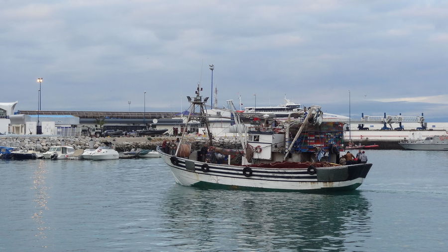 View of fishing boats in harbor