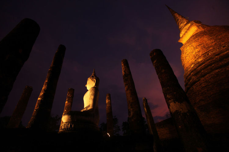 Low angle view of large buddha statue