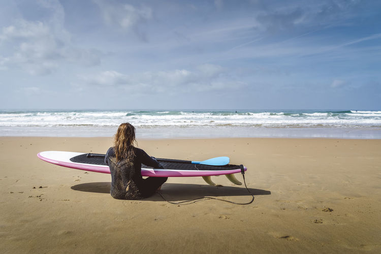 Surfing girl on the ocean