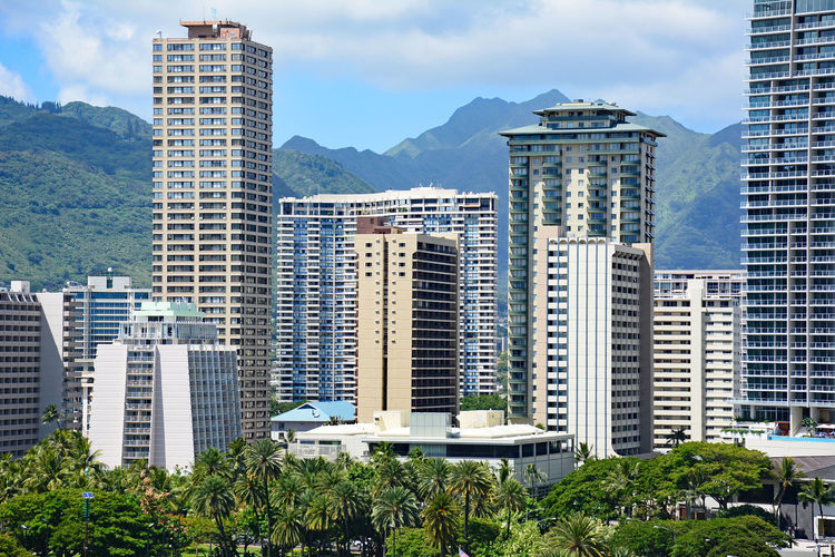 Waikiki highrises with mountains in the background in honolulu on oahu, hawaii. 
