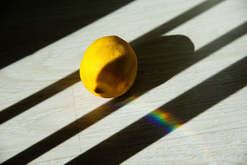High angle view of lemon on table against wall