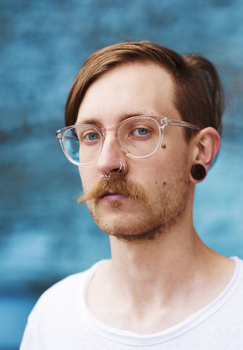 Young men wearing eyeglasses Blue Close-up Day Eyeglasses Eyes Focus On Foreground Glasses Leipzig Lifestyles Looking At Camera Men Moustache One Person Outdoors Portrait Real People Young Adult Young Men This Is Masculinity