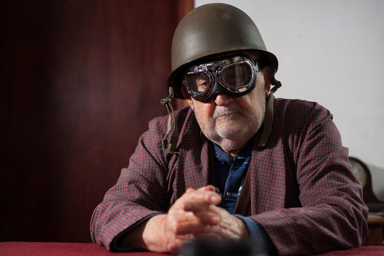 Portrait of senior man wearing aviator glasses and helmet