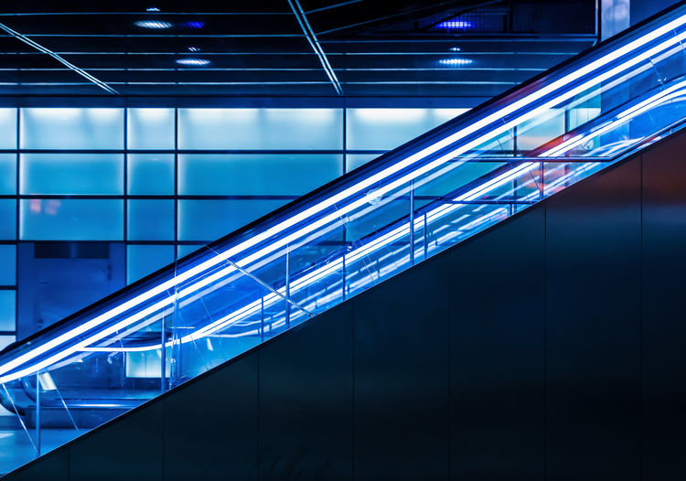 Illuminated escalator at subway station