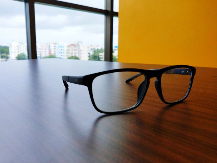 Close-up of eyeglasses on table at office