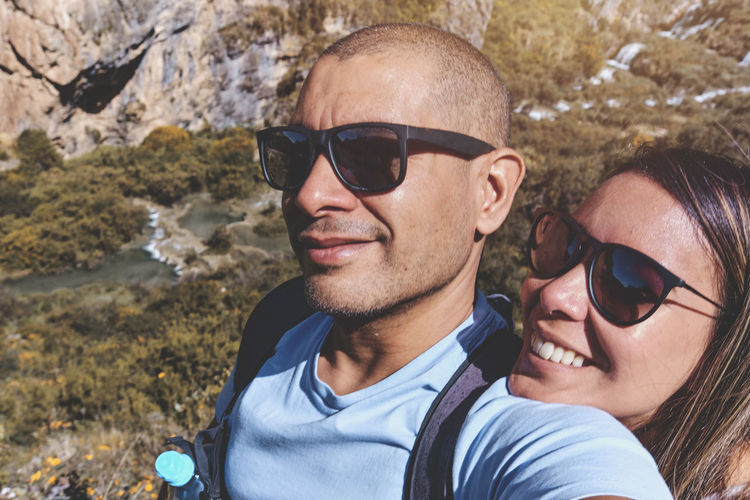 Young couple at viewpoint of the natural pools of millpu, ayacucho, peru. concept about travel