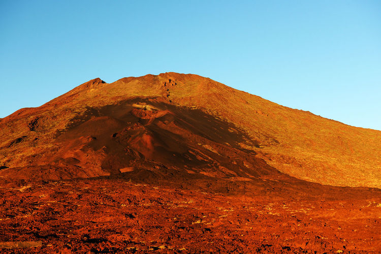 Scenic view of rocky mountains at el teide national park against clear sky