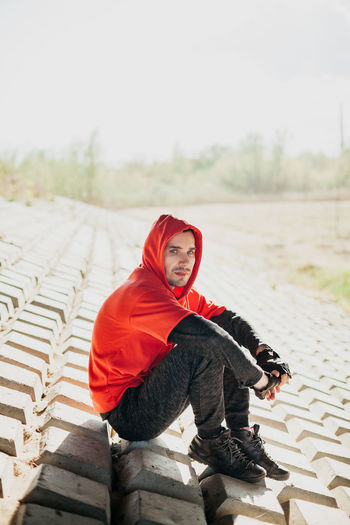 Young man in red hoodie. unusual texture.