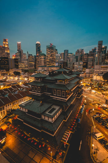 High angle view of city lit up at night