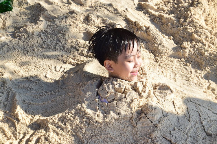 High angle view of boy on beach