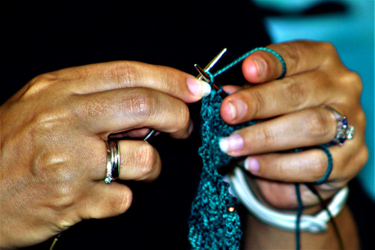 Woman knitting close up of hands