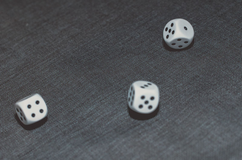 Close-up of dice on fabric