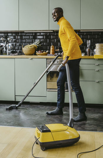 Side view of man working on floor