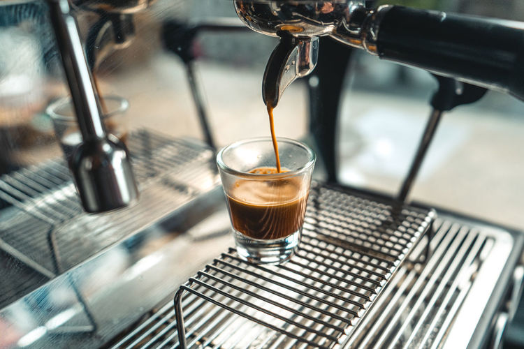Close-up of coffee on espresso maker machine
