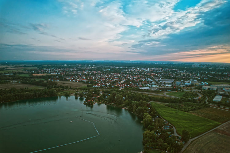 High angle view of townscape against sky during sunset friedberger baggersee