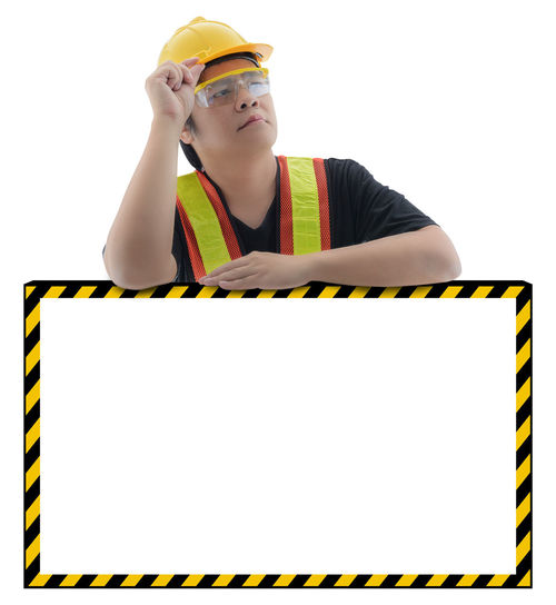 Man holding umbrella against white background