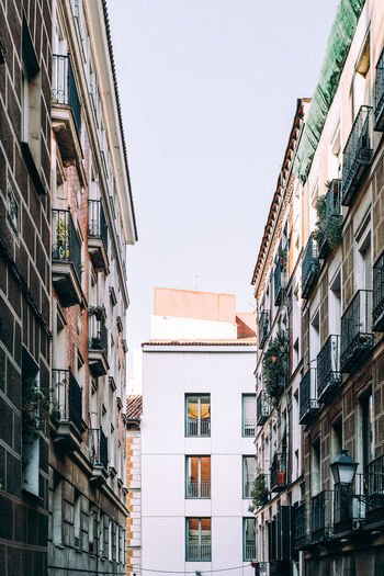 Cityscape of the quarter of lavapies with traditional buildings with balconies. madrid