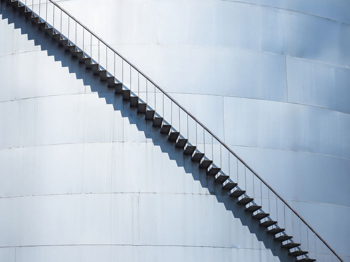 Low angle view of staircase on storage tank