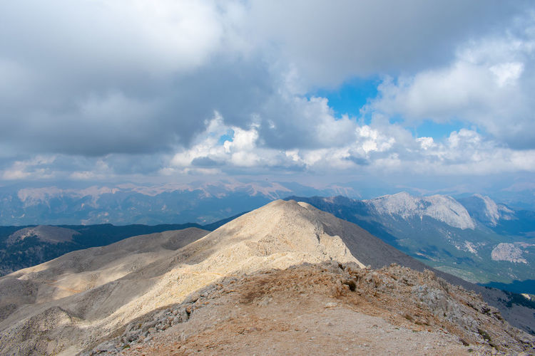 View of mountain range against cloudy sky
