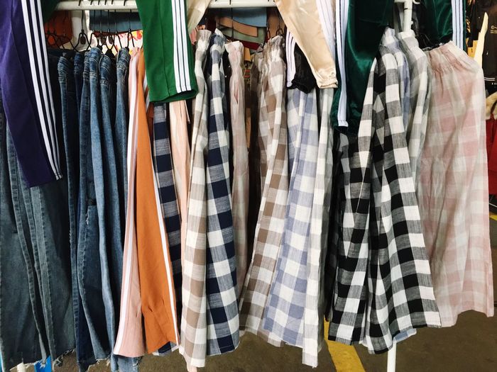 Close-up of clothes hanging in store for sale