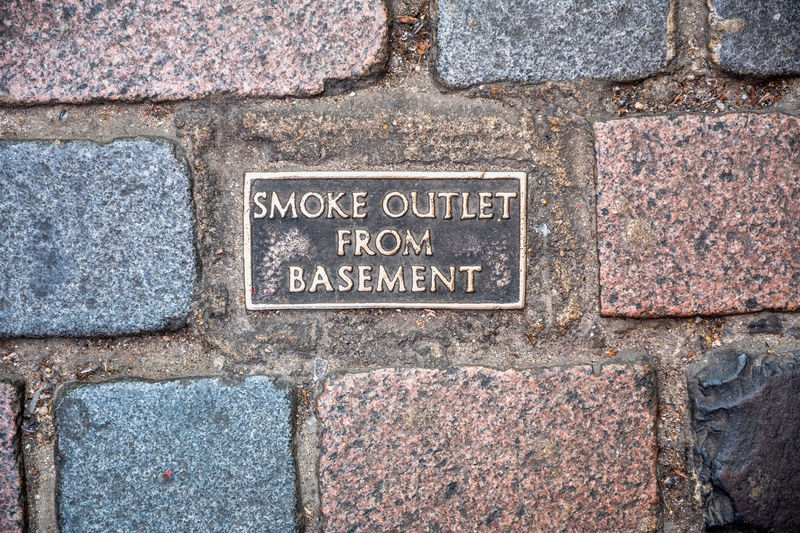 Close-up of text on stone wall