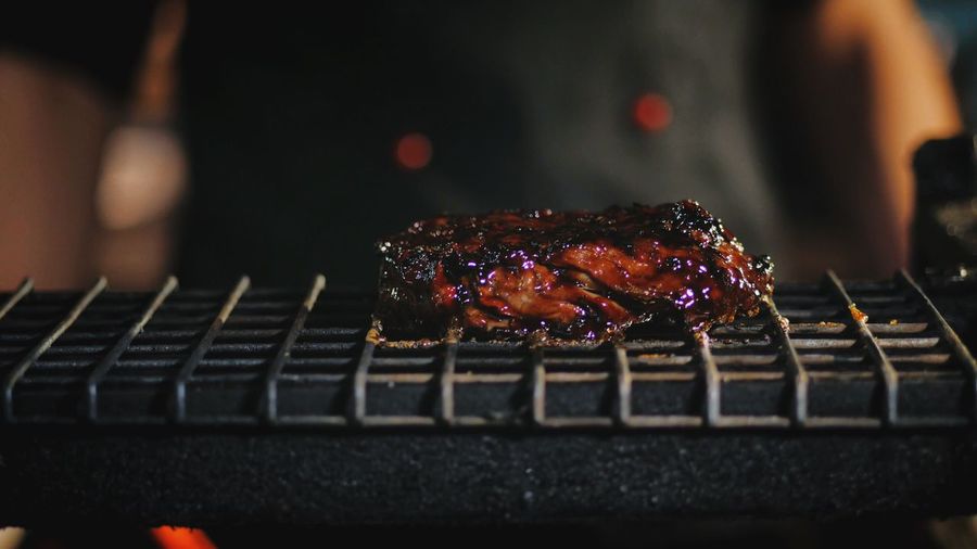 Close-up of meat on barbecue grill