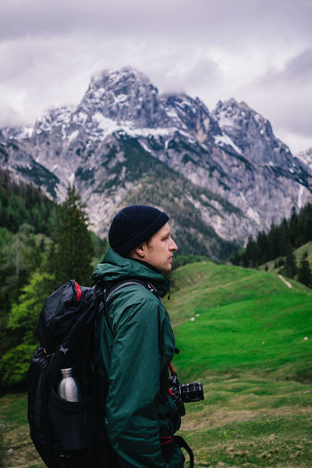 Full length of man standing on mountain against sky