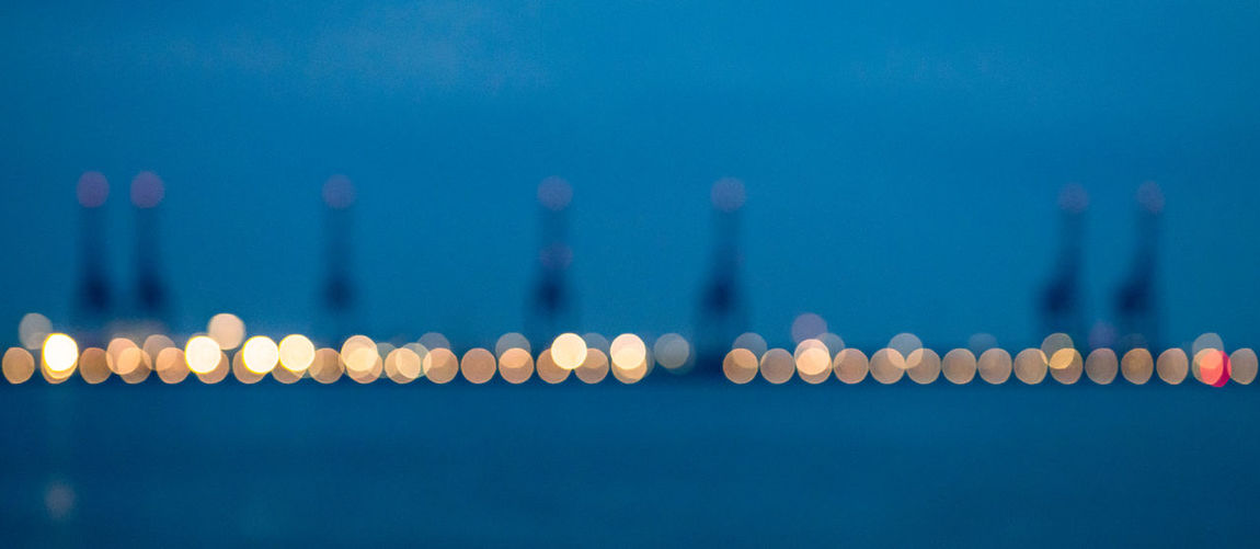 Defocused image of illuminated lights at sea