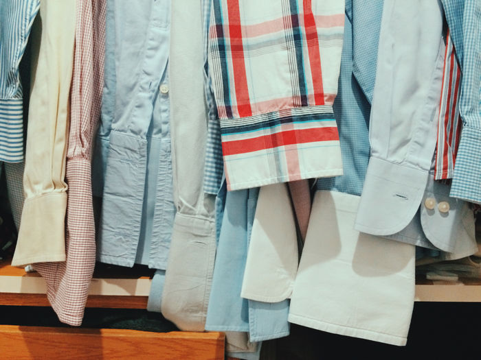 Close-up of shirts hanging in wardrobe