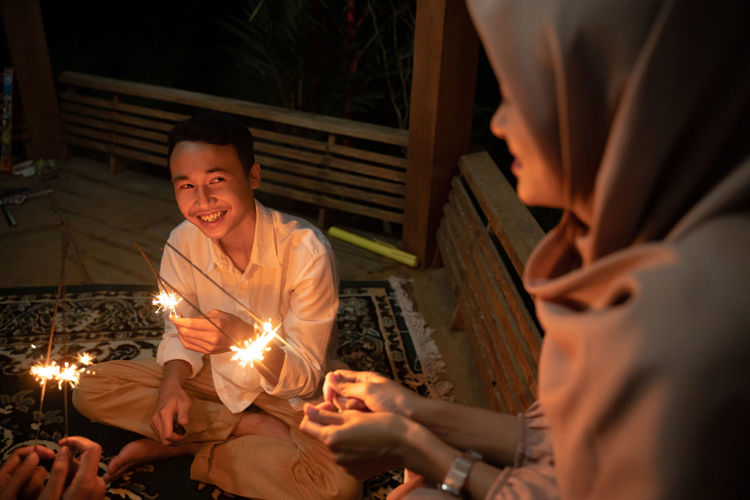 Happy couple holding sparklers