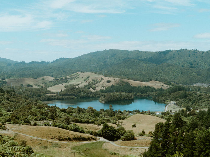 Scenic view of landscape and mountains against sky
