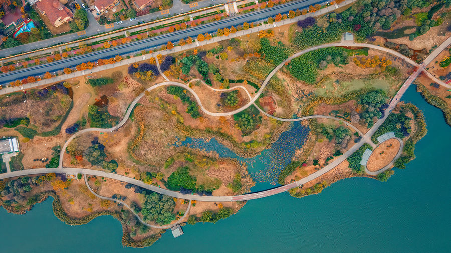 High angle view of road passing through a lake