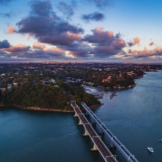 Scenic view of river against sky at sunset