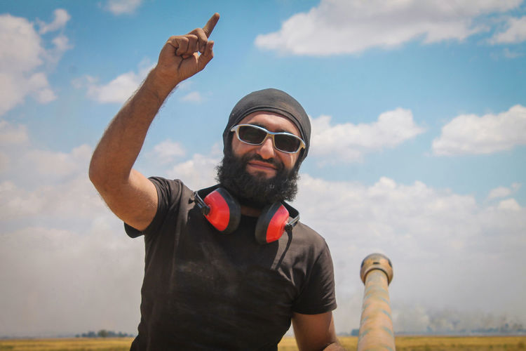 A fighter dressed as isis. jihadist extremists. war in the middle east.