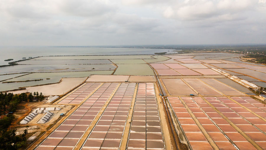 Aerial drone of salt fields of the plantation and pools with sea water. salt production in sri lanka