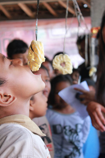Cracker eating competition or lomba makan kerupuk on indonesia's independence day