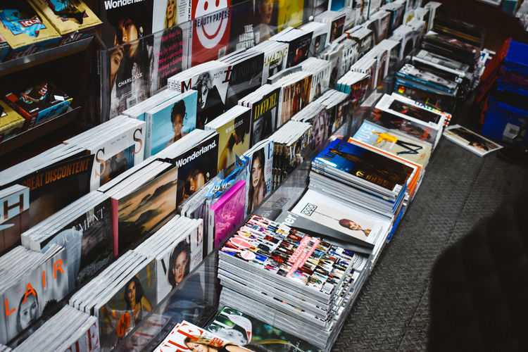 High angle view of magazines for sale