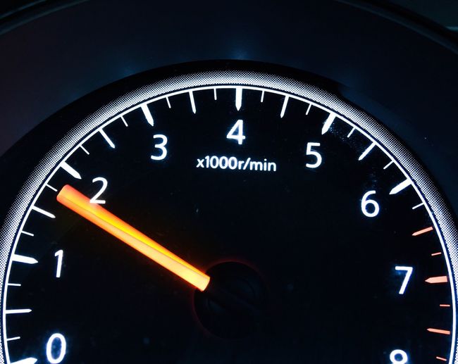 Close-up of clock on car windshield