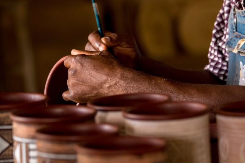 Close-up of man working in clay