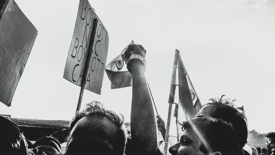 Low angle view of people against the sky