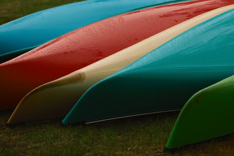 Colorful boats on field