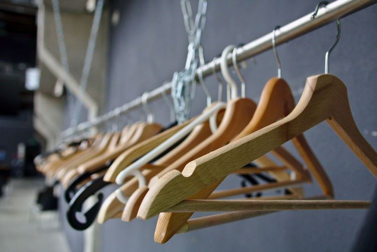 Close-up of clothespins hanging on rope