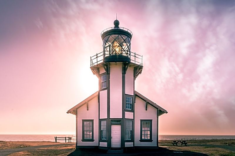 Point cabrillo lighthouse at beach during sunset