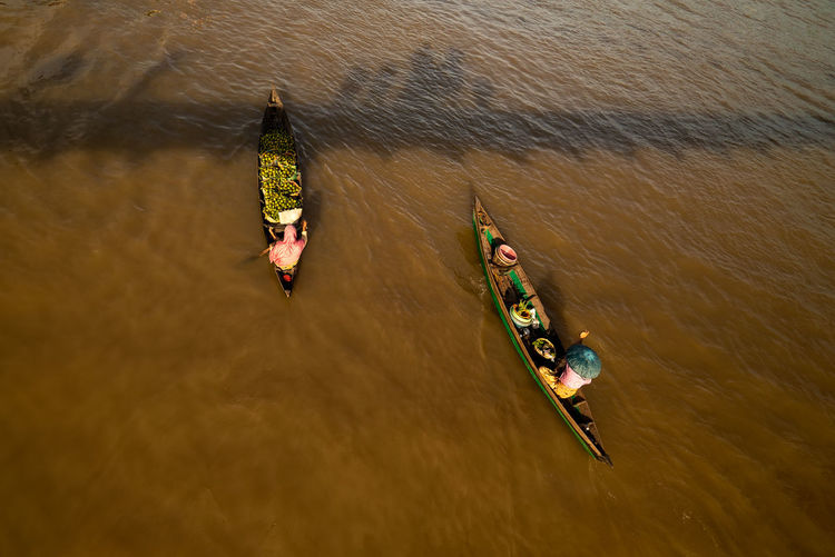 High angle view of floating market vendors in lake