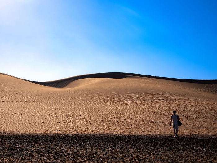 Man walking in the maspalomas sand dunes