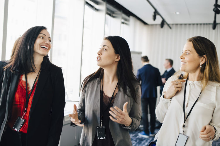 Female entrepreneurs discussing while walking at workplace