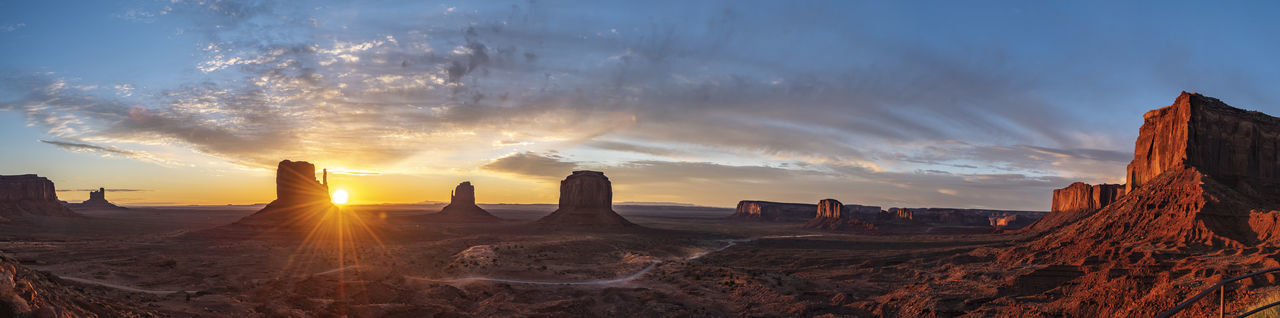 Panoramic view of rock formations against sky during sunset