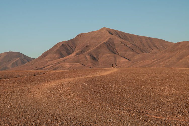 Desert path red soil blue sky