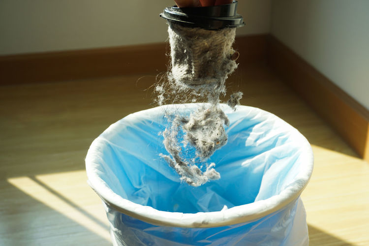 Close-up of dust falling in bucket