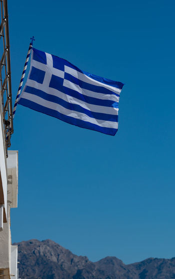 Greece flag on a building in kardamaina kos